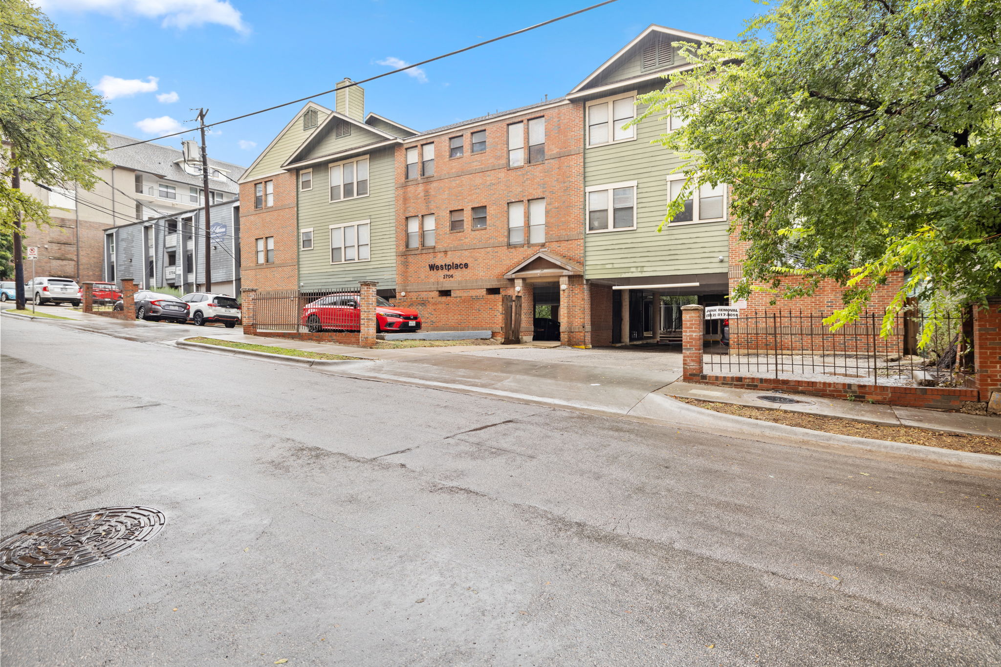2706 Salado Street, Unit 210 Austin, TX 78705 - Photo 2 of 32 a view of a street with a building in the background