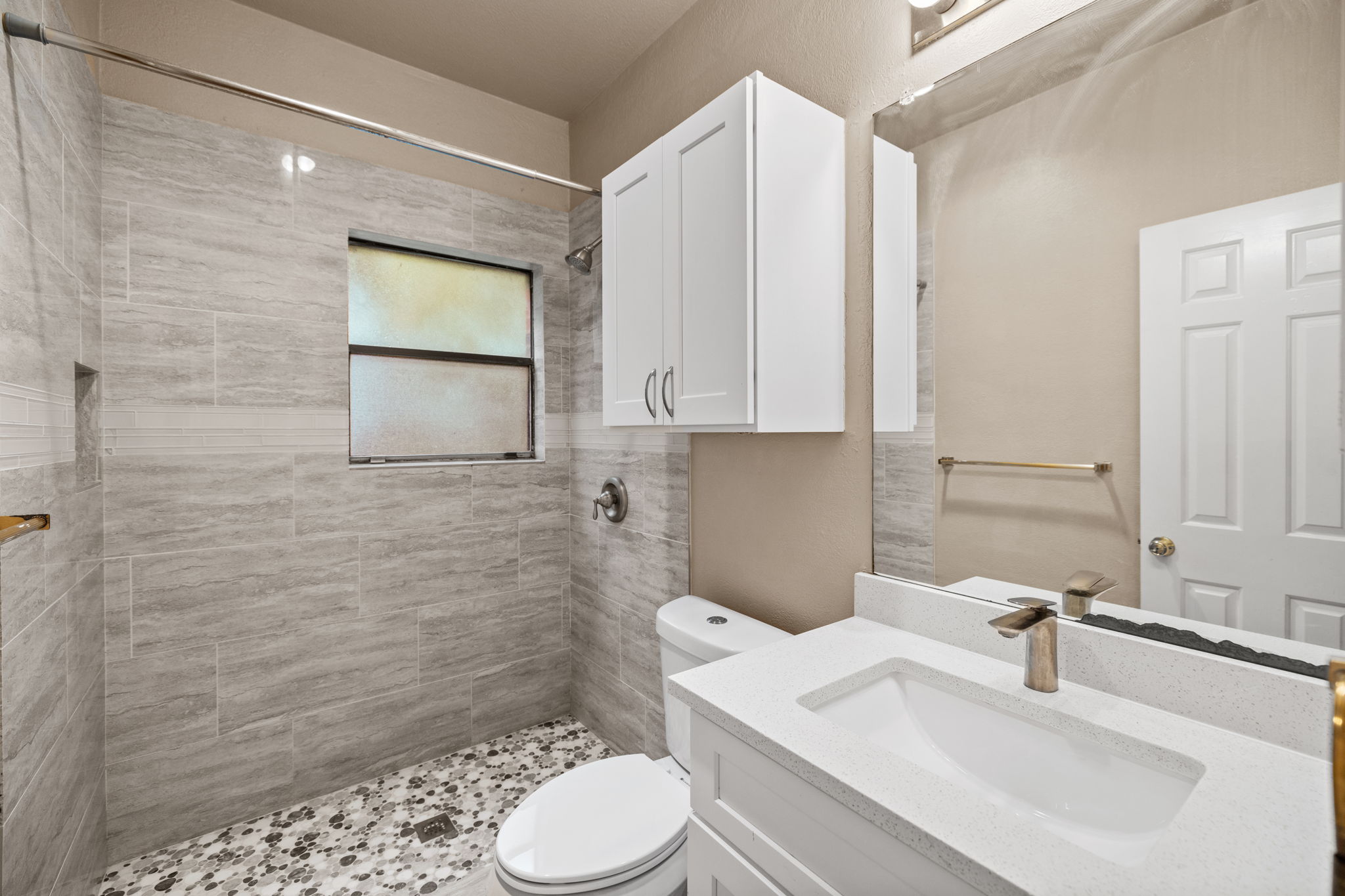 2706 Salado Street, Unit 210 Austin, TX 78705 - Photo 21 of 32 a bathroom with a sink a toilet and shower