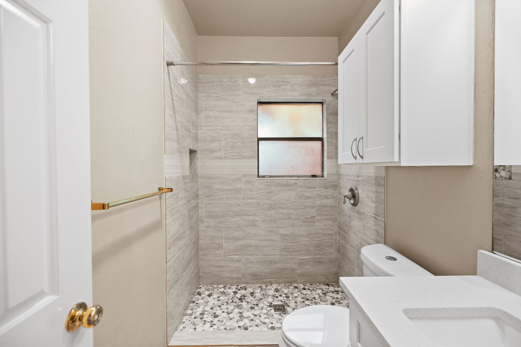2706 Salado Street, Unit 210 Austin, TX 78705 - Photo 22 of 32 a bathroom with a toilet and a shower