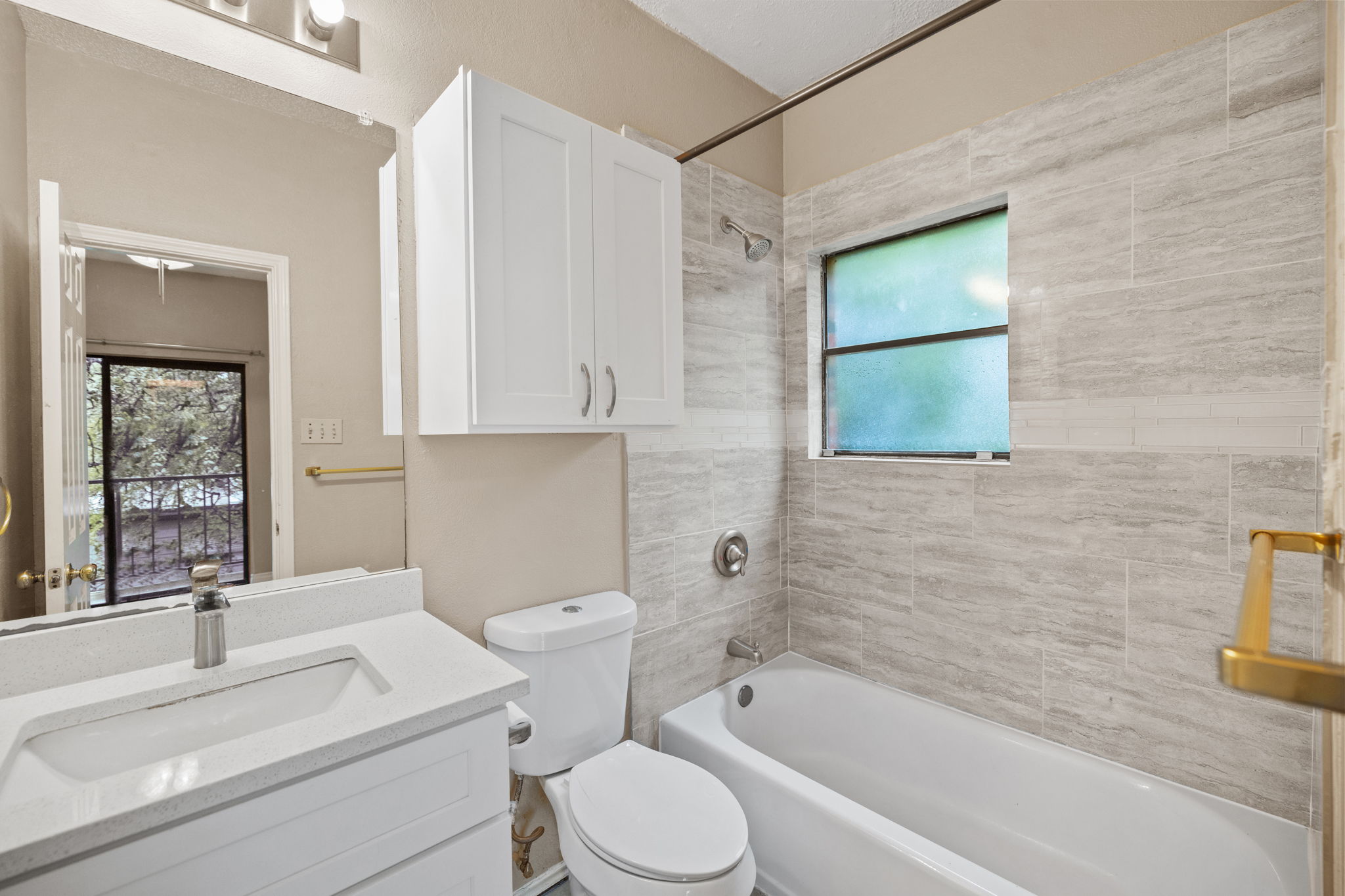2706 Salado Street, Unit 210 Austin, TX 78705 - Photo 29 of 32 a bathroom with a sink toilet and shower