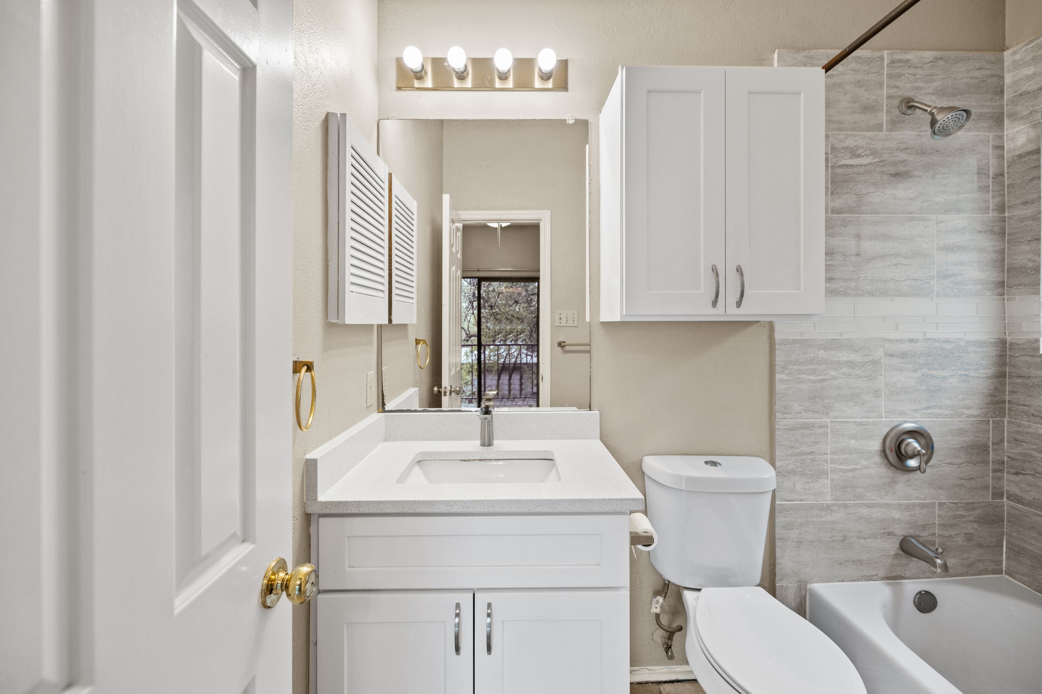 2706 Salado Street, Unit 210 Austin, TX 78705 - Photo 30 of 32 a bathroom with a sink a toilet and shower