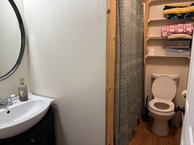 a bathroom with a toilet and a sink