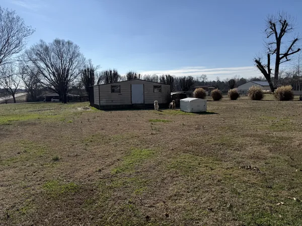 a row yard with a barn