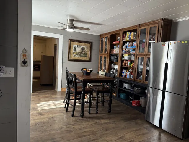 a view of a dining room with furniture and wooden floor