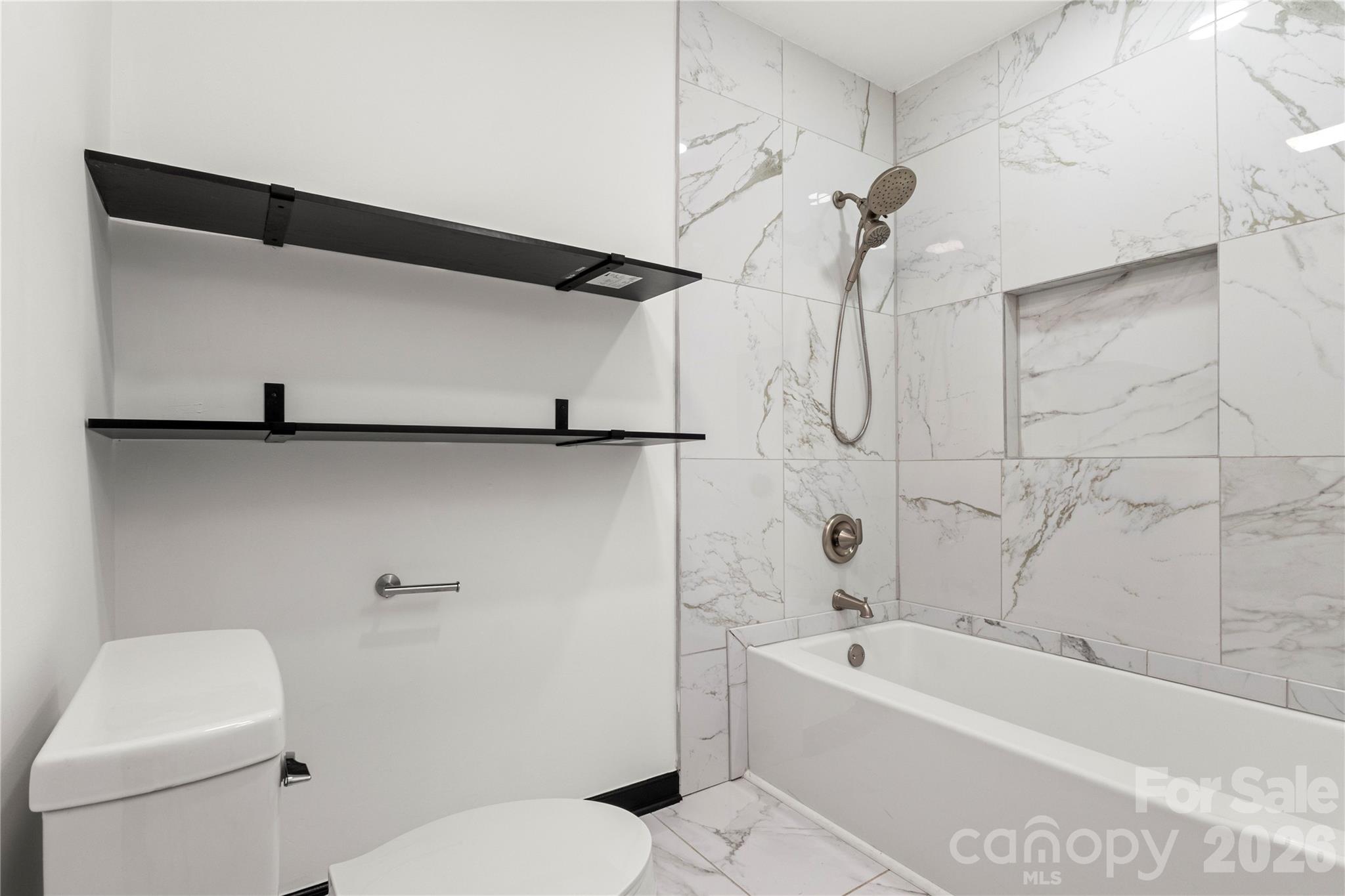 110 Courtland Street Chester, SC 29706 - Photo 13 of 22 a bathroom with a toilet a sink and bathtub