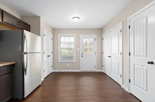 a view of an empty room with a window
