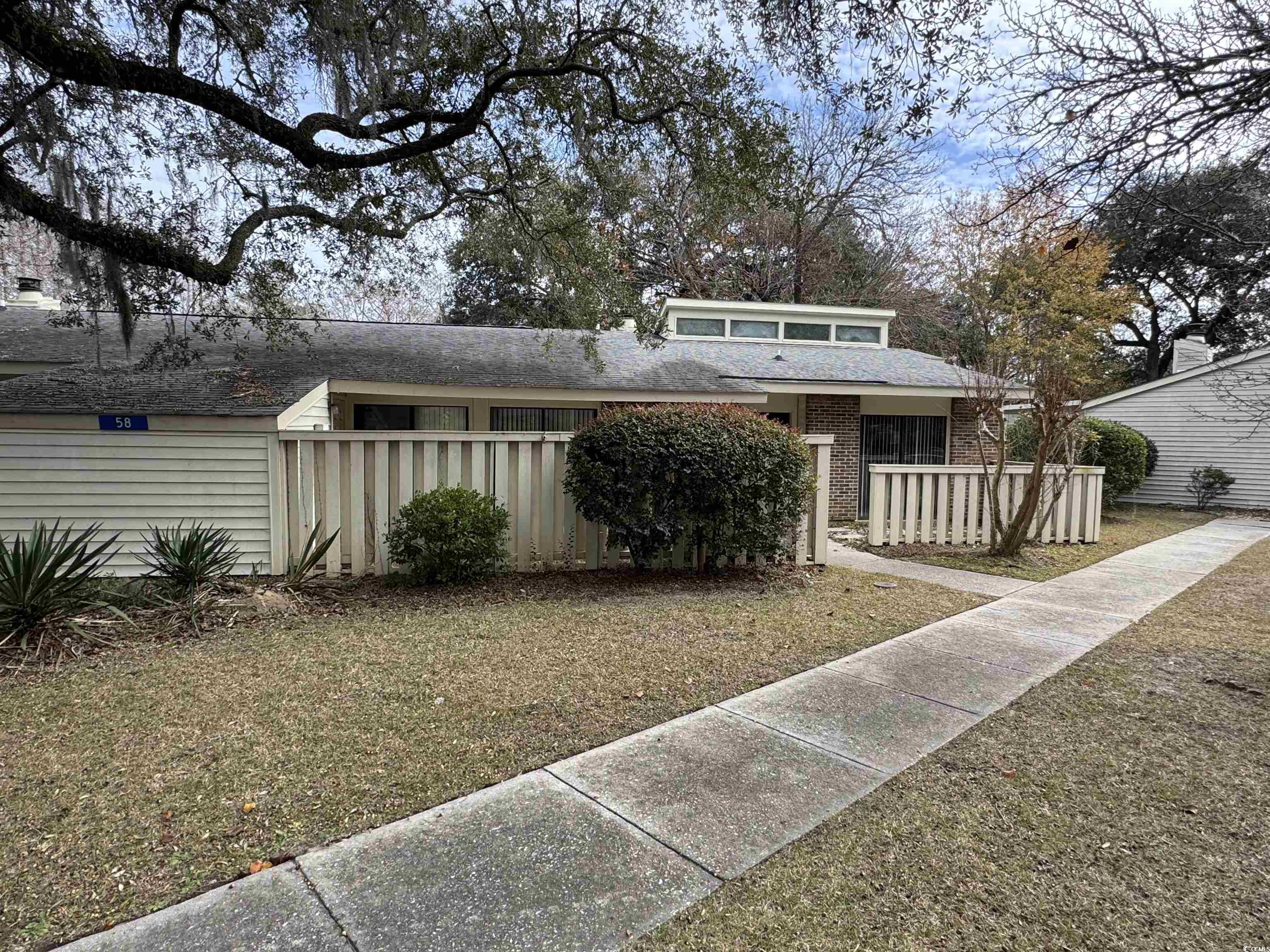 58 Wedgefield Village Road, Unit 48 Georgetown, SC 29440 - Photo 1 of 23 Mid-century home with a porch