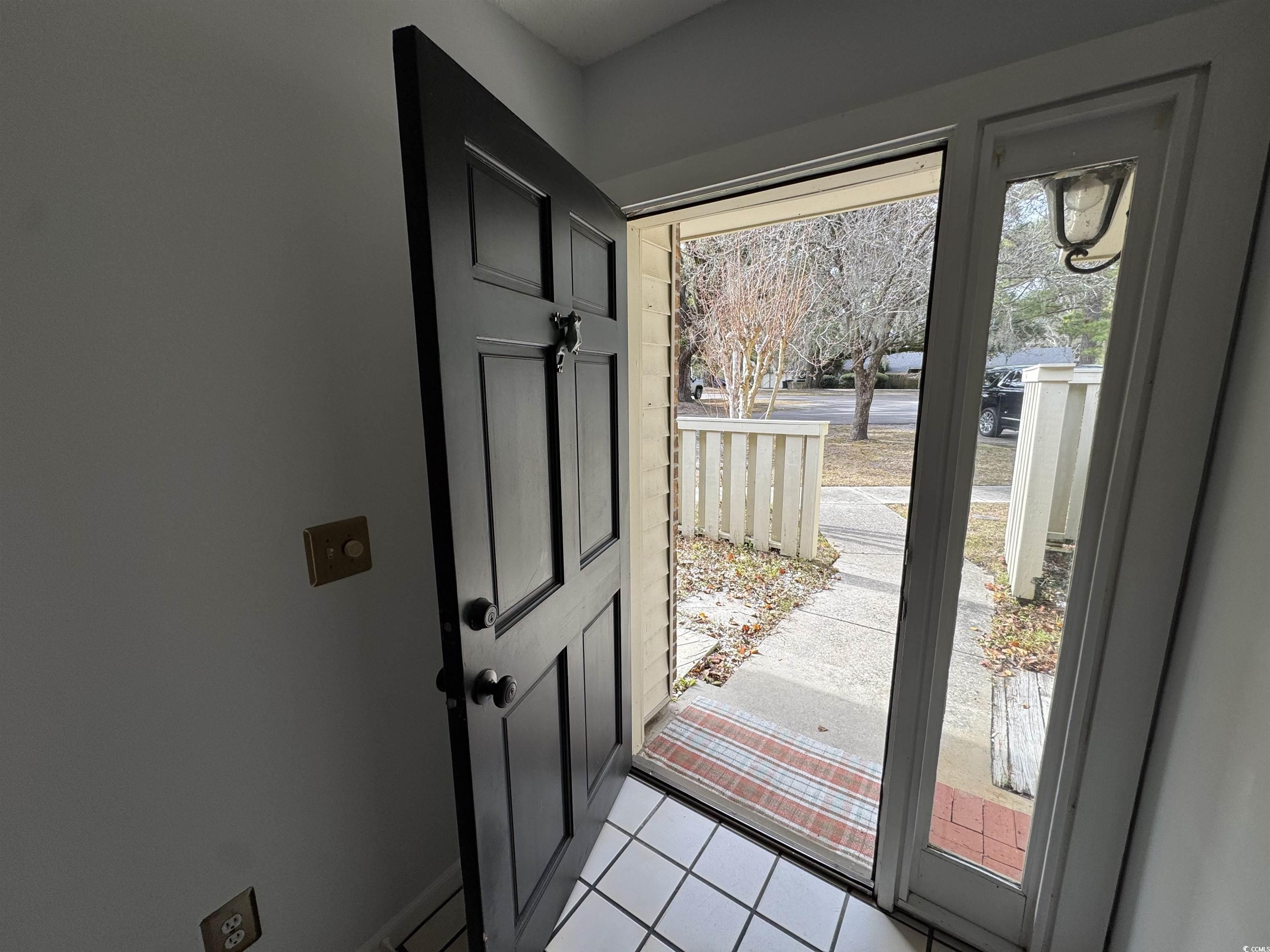 58 Wedgefield Village Road, Unit 48 Georgetown, SC 29440 - Photo 4 of 23 Entryway with tile patterned floors