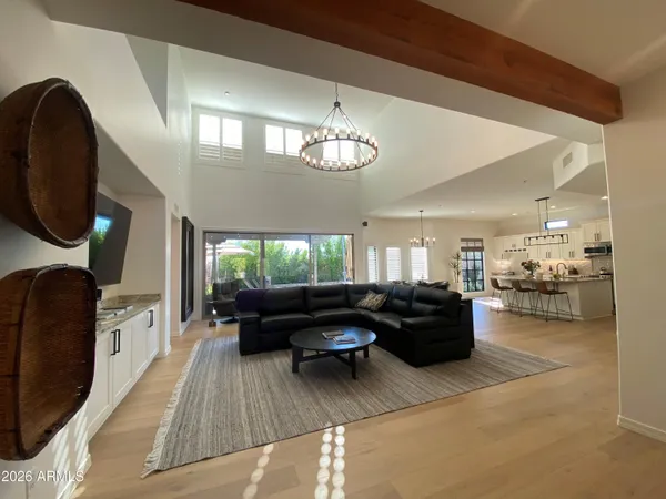 a bedroom with a bed and glass door