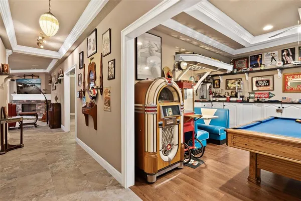 a living room with furniture a ceiling fan and a rug