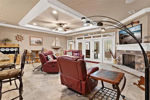 a kitchen with kitchen island granite countertop lots of counter top space a sink stainless steel appliances and cabinets