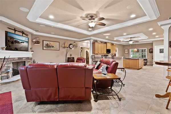 a kitchen with stainless steel appliances granite countertop a sink a stove and a refrigerator