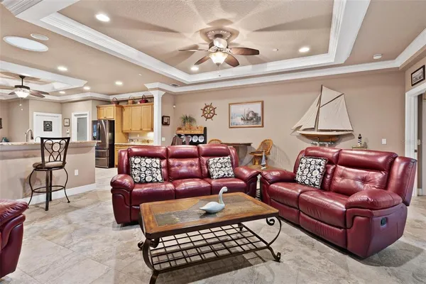 a kitchen with stainless steel appliances granite countertop a sink a stove cabinets and a refrigerator