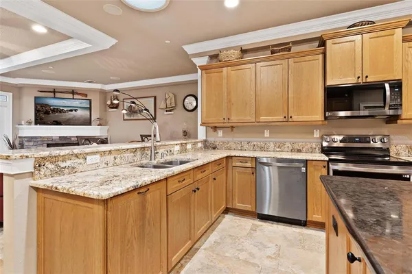a bathroom with a granite countertop sink a large mirror and a bathtub