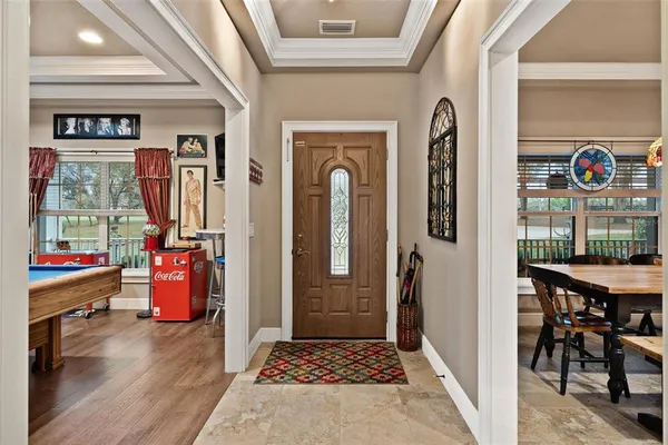 a living room with furniture and ceiling fan