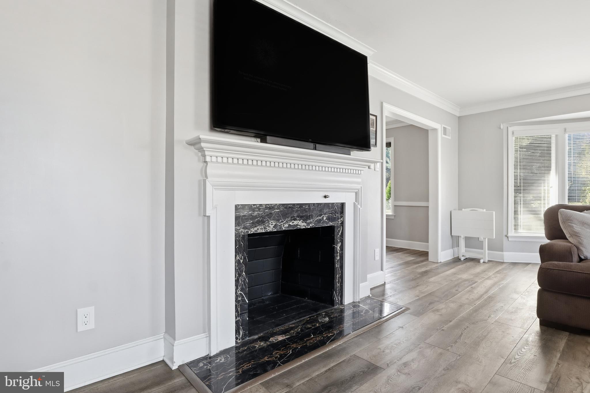 1000 Smallbrook Lane York, PA 17403 - Photo 13 of 84 a living room with a fireplace and a flat screen tv