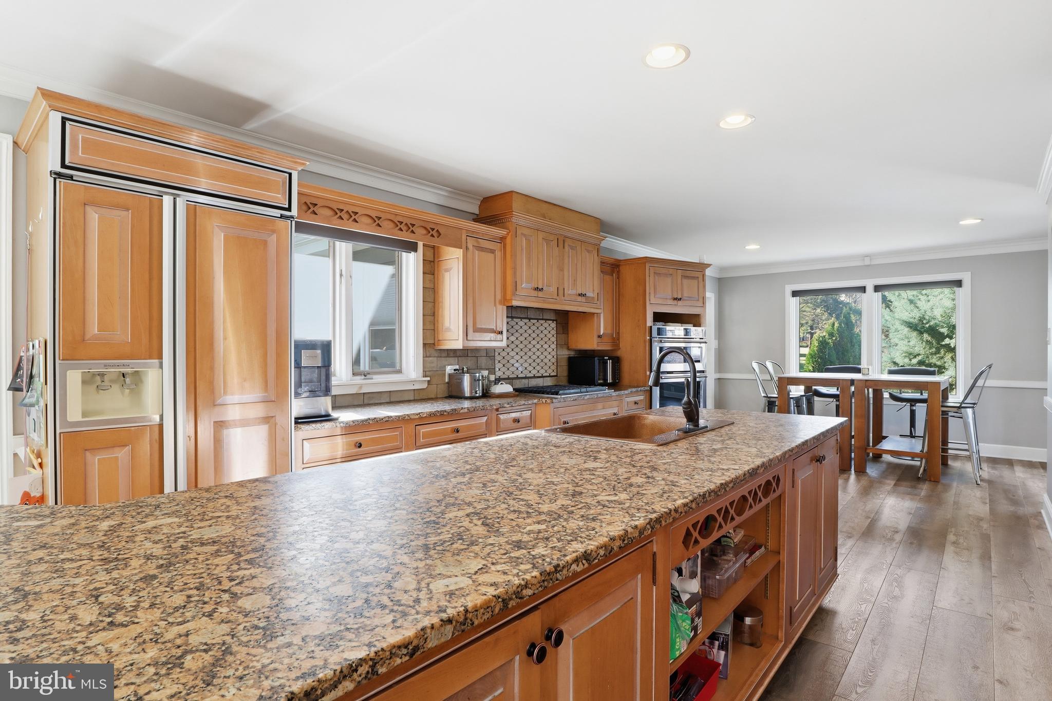 1000 Smallbrook Lane York, PA 17403 - Photo 18 of 84 a kitchen with stainless steel appliances granite countertop a sink stove and wooden floor