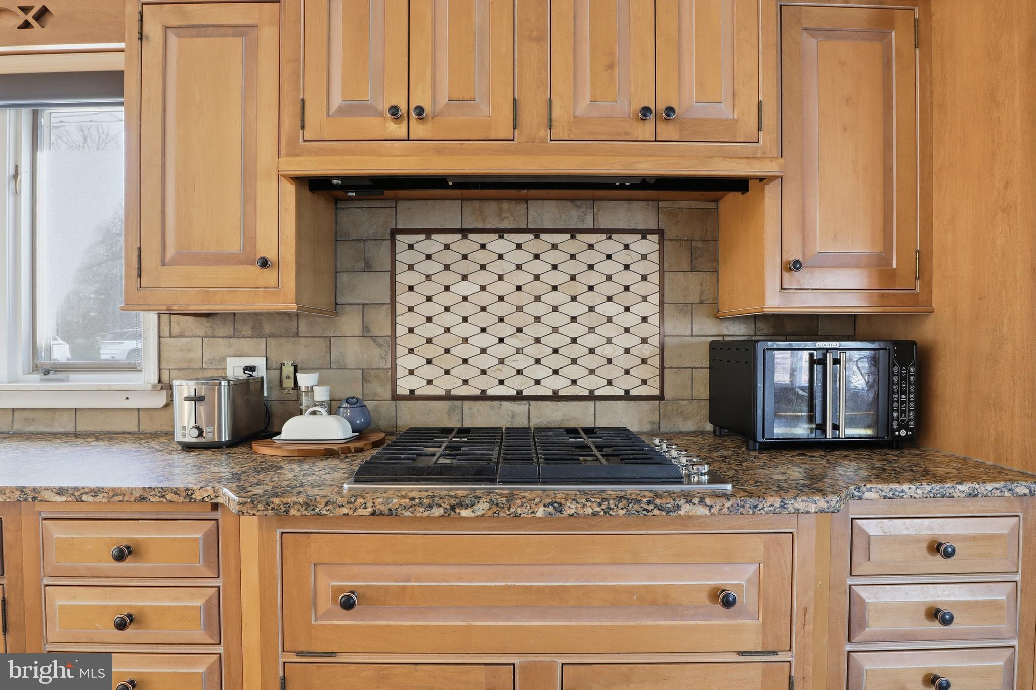 1000 Smallbrook Lane York, PA 17403 - Photo 20 of 84 a kitchen with granite countertop cabinets and a stove