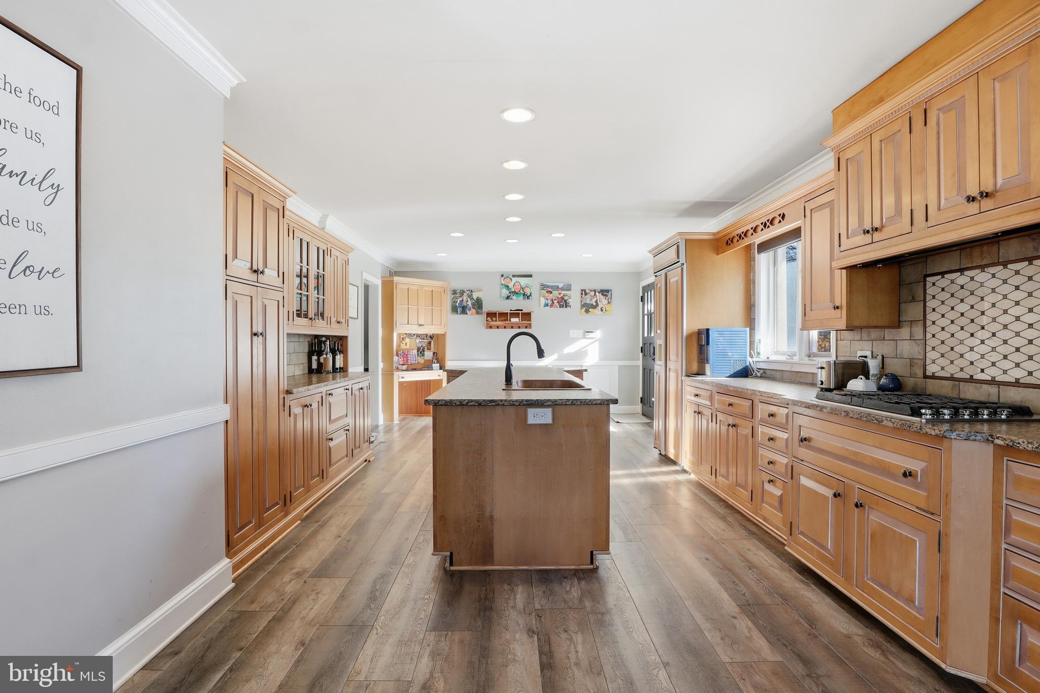 1000 Smallbrook Lane York, PA 17403 - Photo 22 of 84 a kitchen with stainless steel appliances granite countertop a refrigerator a stove top oven and white cabinets with wooden floor