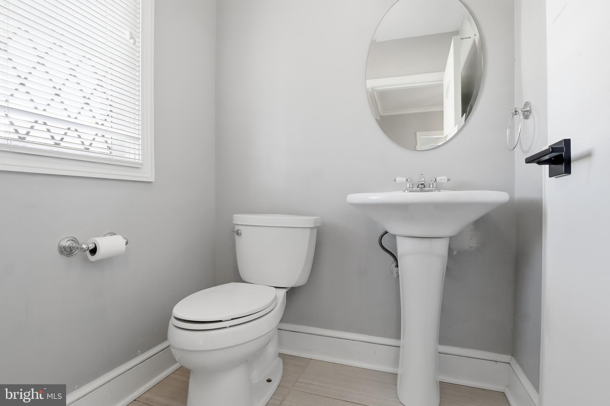 1000 Smallbrook Lane York, PA 17403 - Photo 27 of 84 a bathroom with a toilet sink and mirror