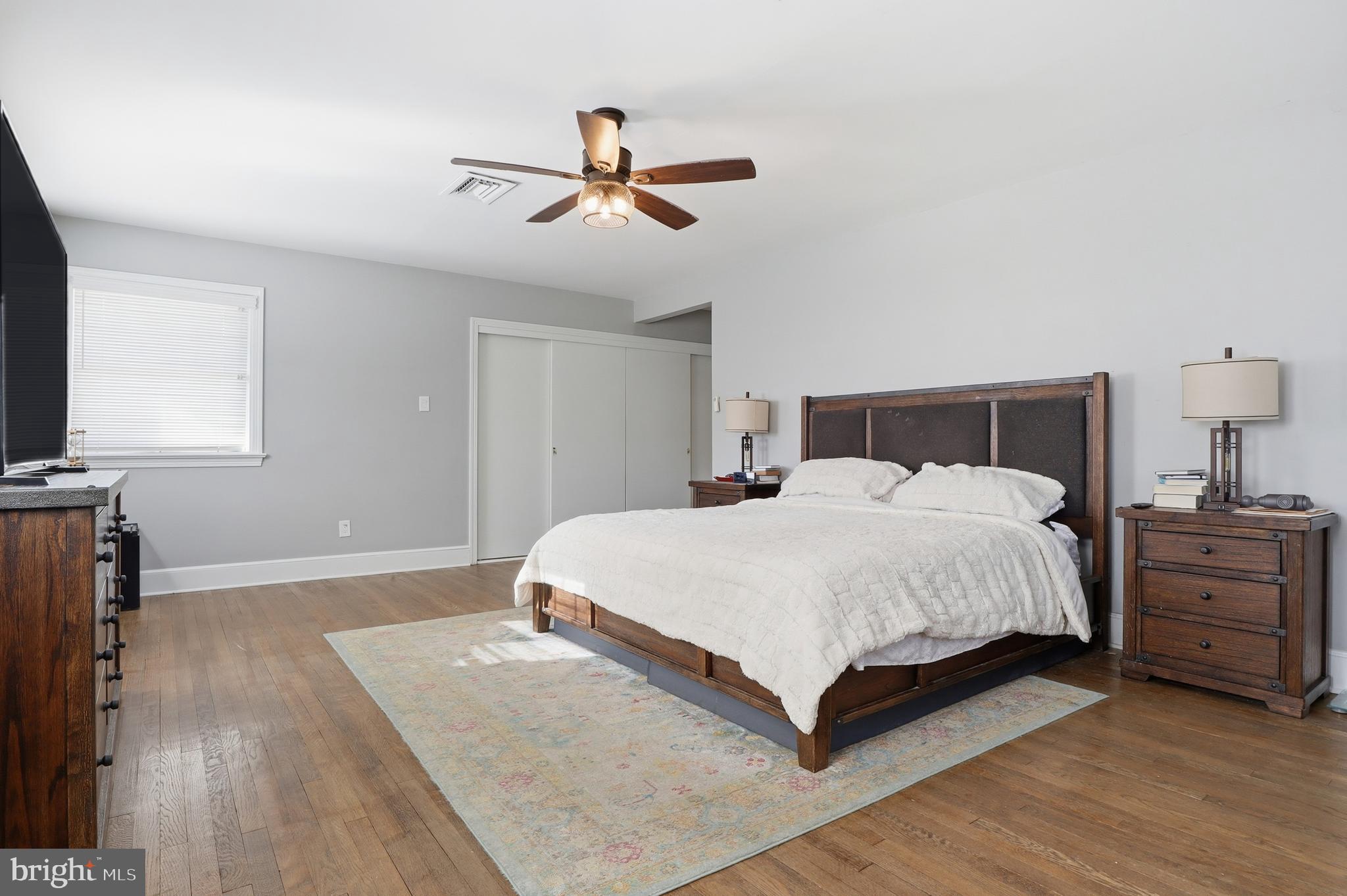 1000 Smallbrook Lane York, PA 17403 - Photo 35 of 84 a bedroom with a large bed and a flat tv screen on dresser