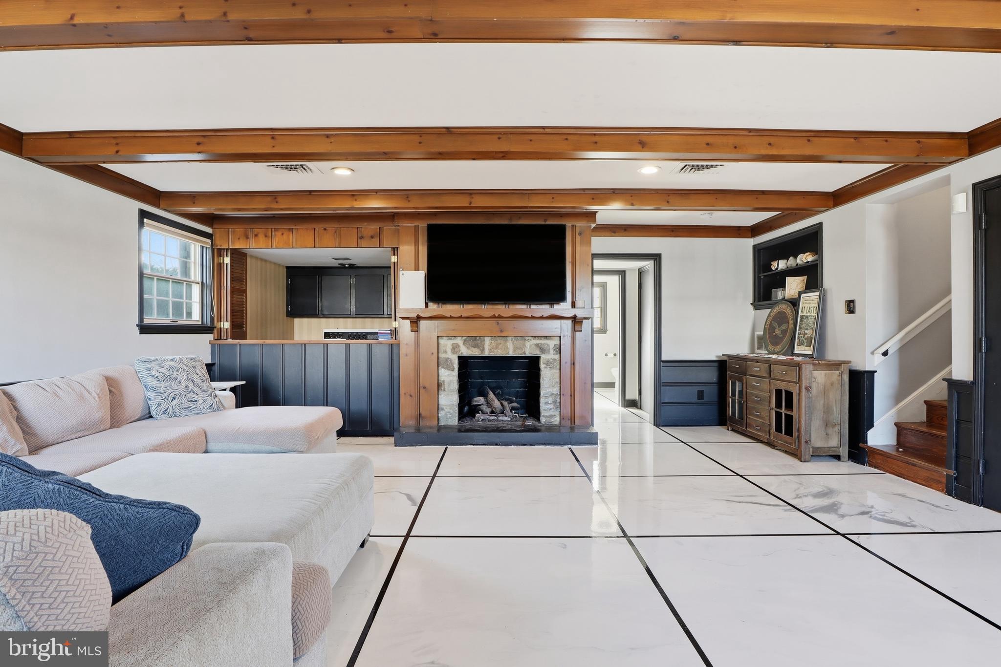 1000 Smallbrook Lane York, PA 17403 - Photo 48 of 84 a living room with furniture a flat screen tv and a fireplace