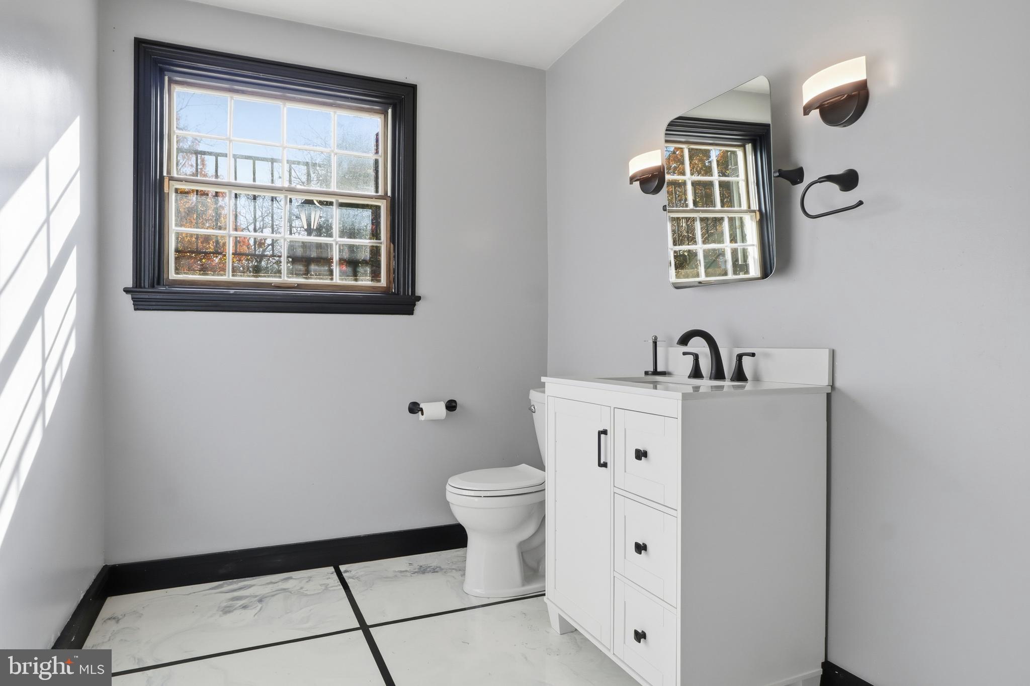 1000 Smallbrook Lane York, PA 17403 - Photo 49 of 84 a view of a bathroom with a sink a toilet and a window