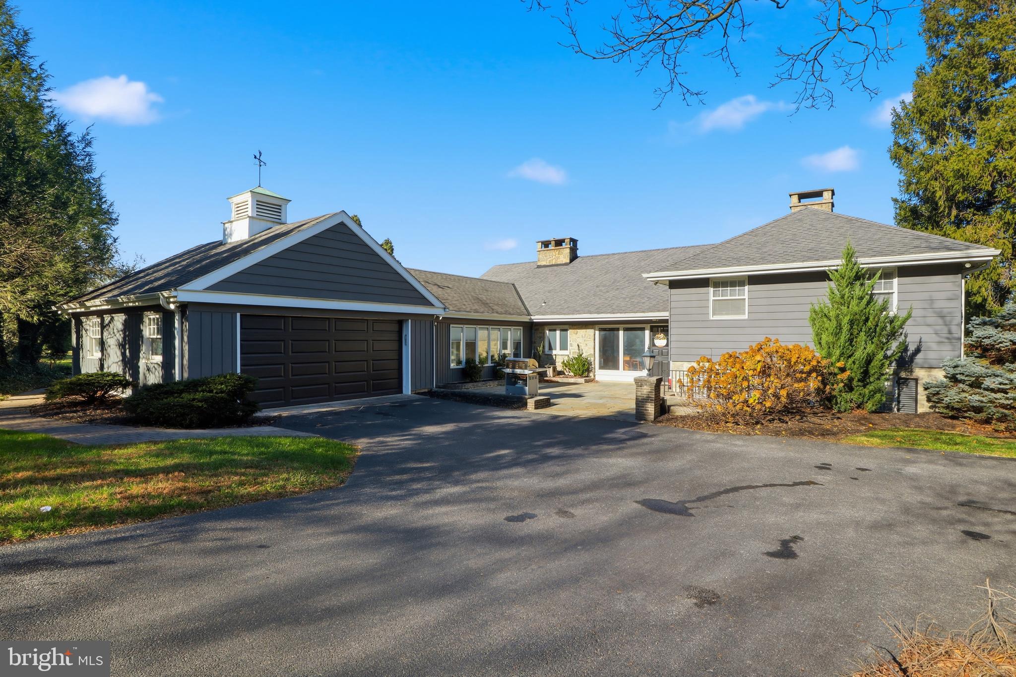 1000 Smallbrook Lane York, PA 17403 - Photo 51 of 84 a front view of a house with a garden