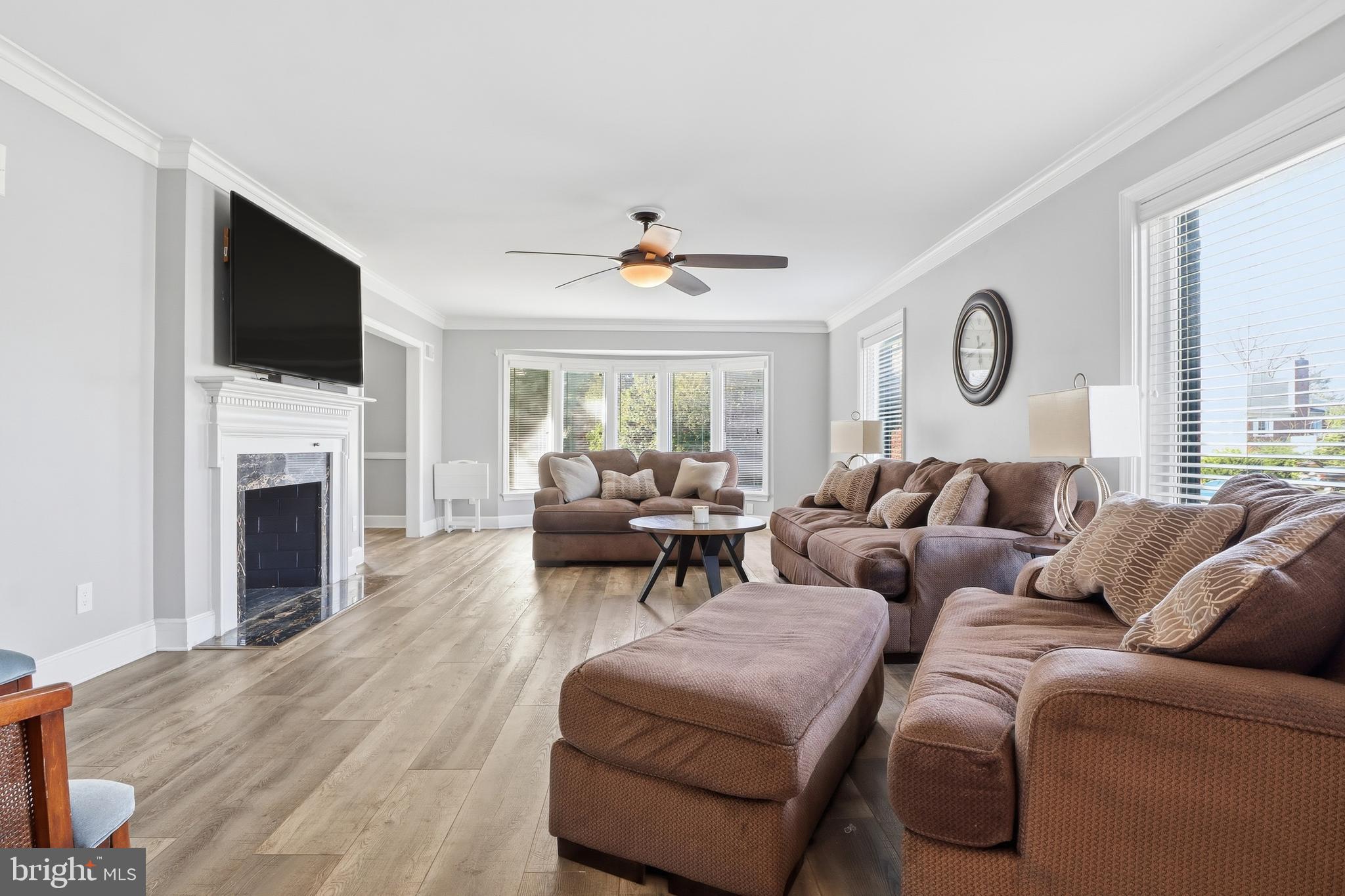 1000 Smallbrook Lane York, PA 17403 - Photo 9 of 84 a living room with furniture a fireplace and a flat screen tv