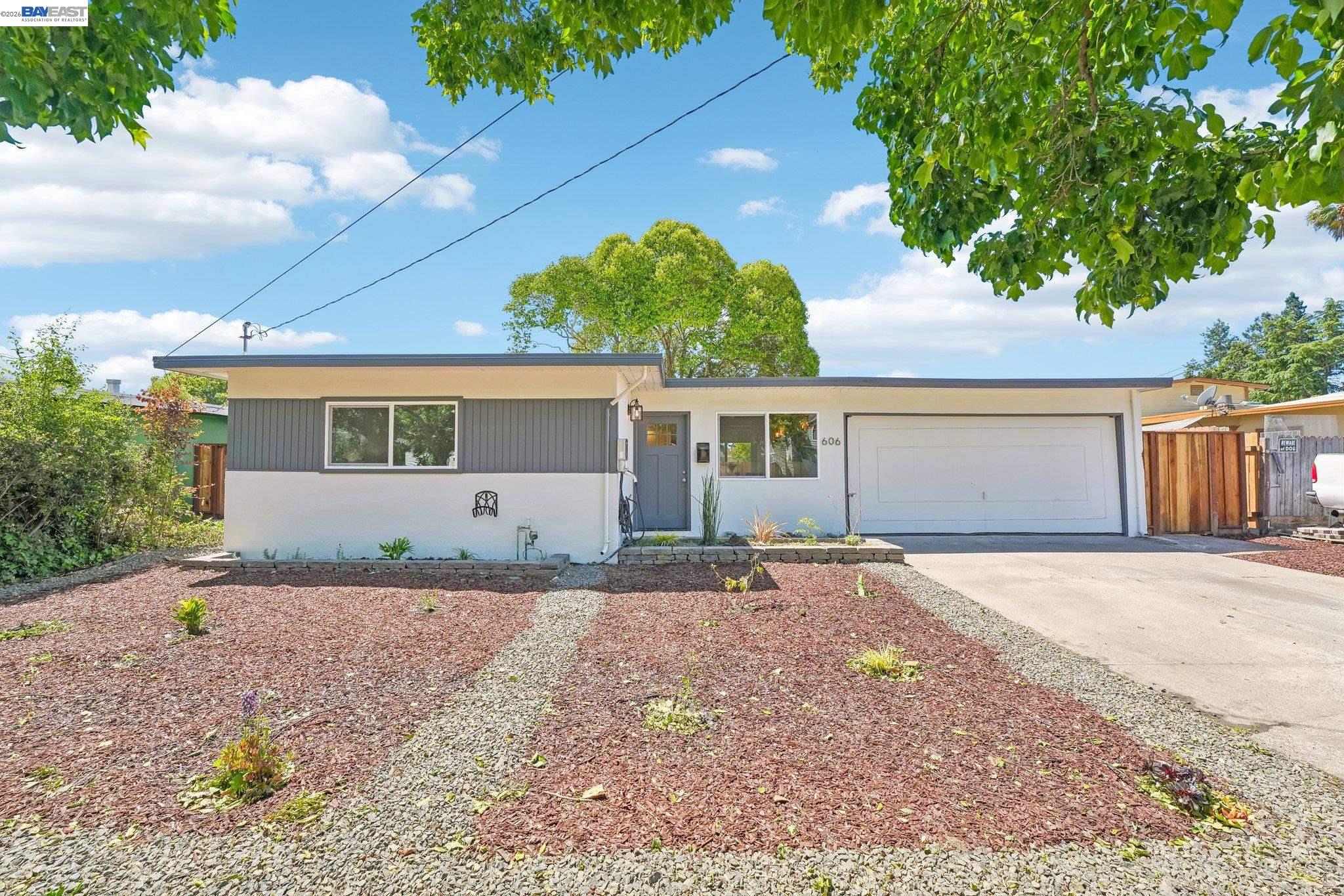606 West 9th Street Santa Rosa, CA 95401 - Photo 1 of 52 a front view of a house with a yard and garage
