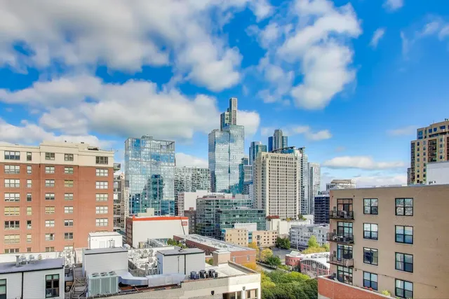 a view of city with tall buildings