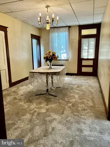 a view of a livingroom with furniture window and wooden floor