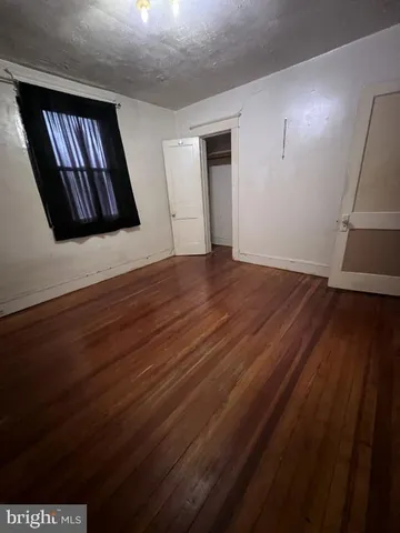 wooden floor in a hall with an entryway