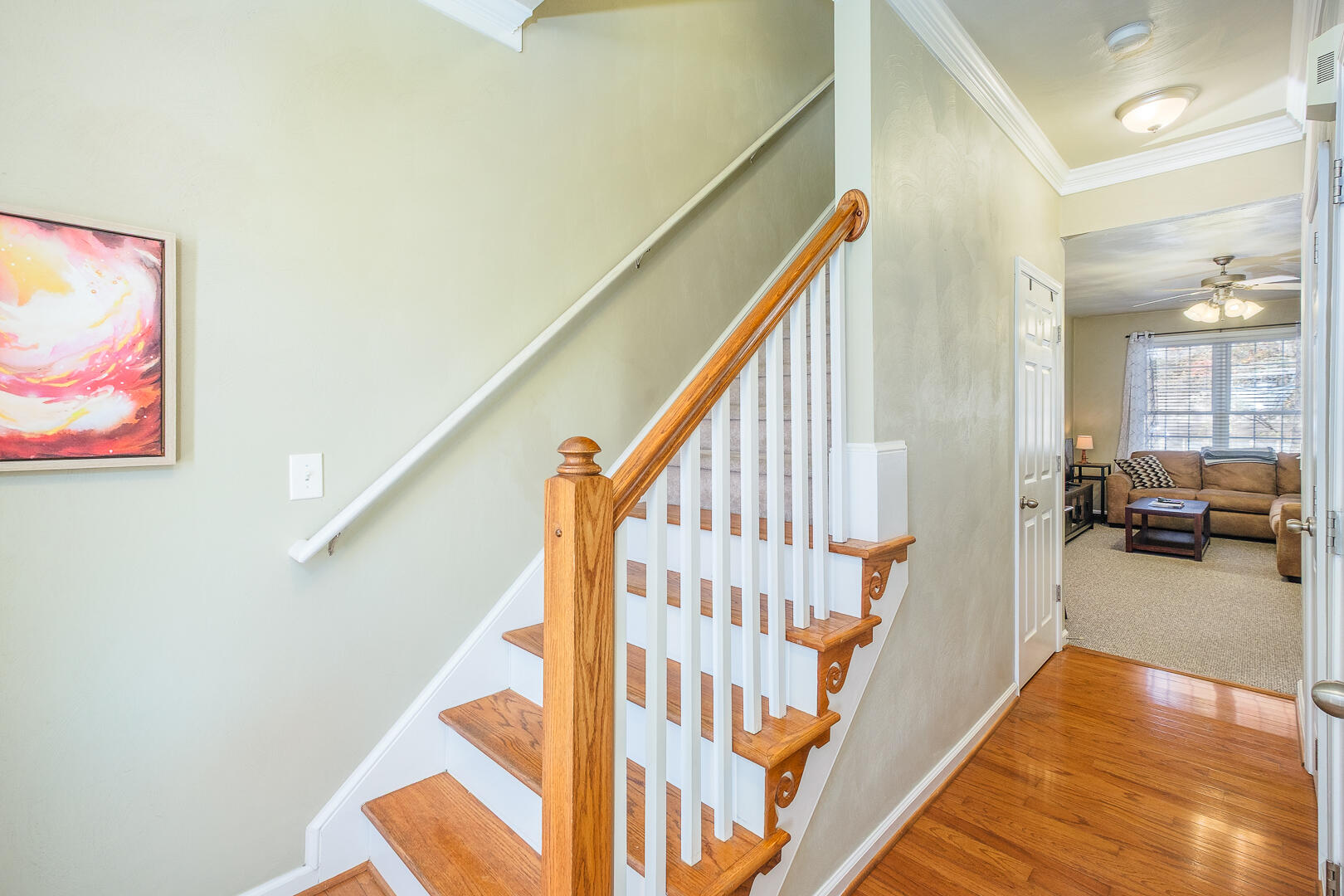 8717 Little Hoop Road Roanoke, VA 24019 - Photo 14 of 31 a view of a hallway with wooden floor and staircase