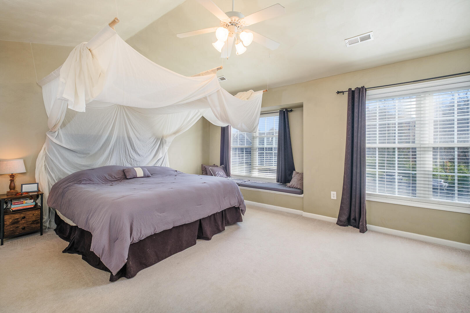 8717 Little Hoop Road Roanoke, VA 24019 - Photo 19 of 31 a spacious bedroom with a bed and a chandelier