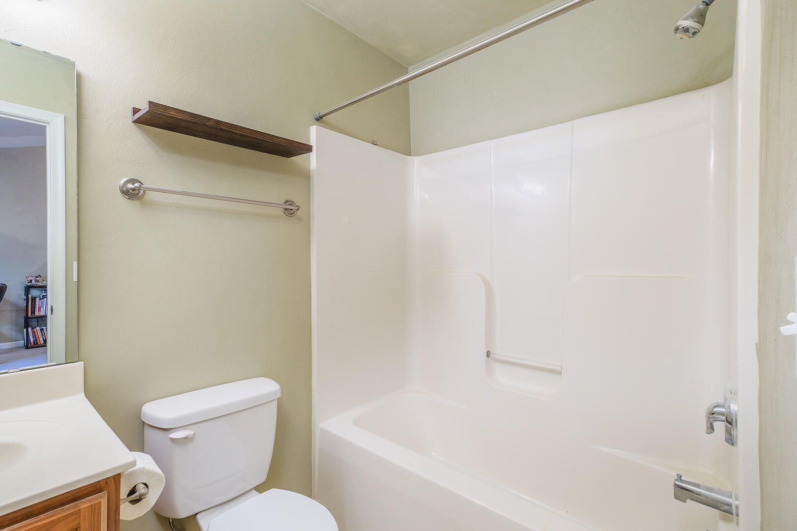 8717 Little Hoop Road Roanoke, VA 24019 - Photo 24 of 31 a white toilet sitting next to a bath tub