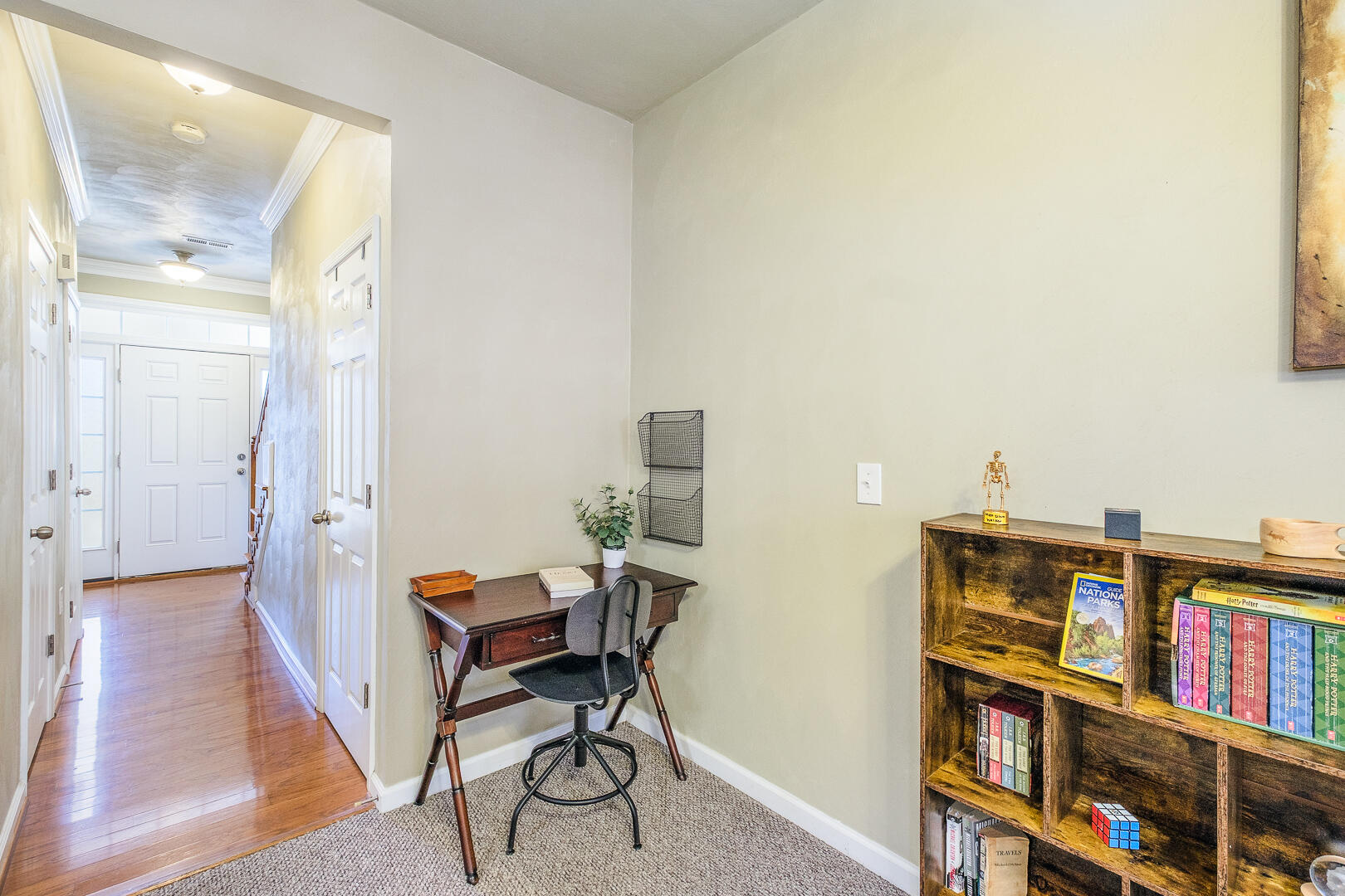 8717 Little Hoop Road Roanoke, VA 24019 - Photo 3 of 31 a view of a workspace with furniture and a book shelf