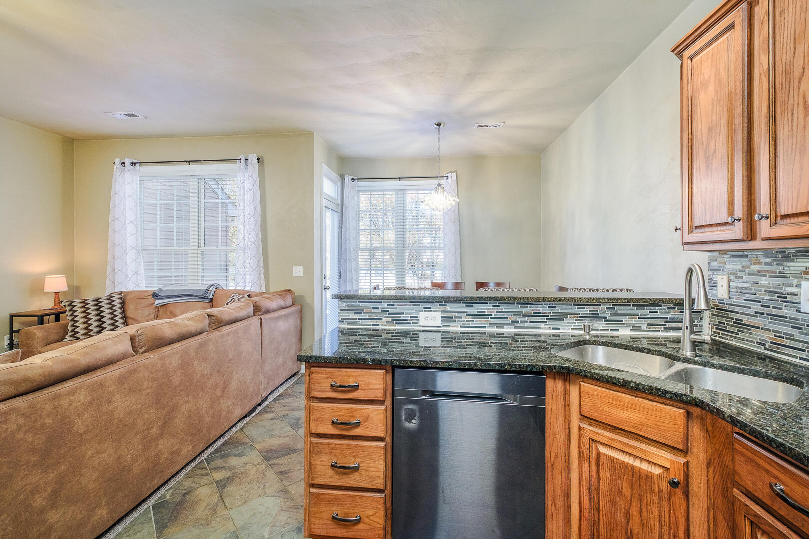 8717 Little Hoop Road Roanoke, VA 24019 - Photo 9 of 31 a kitchen with granite countertop a sink and a counter top space