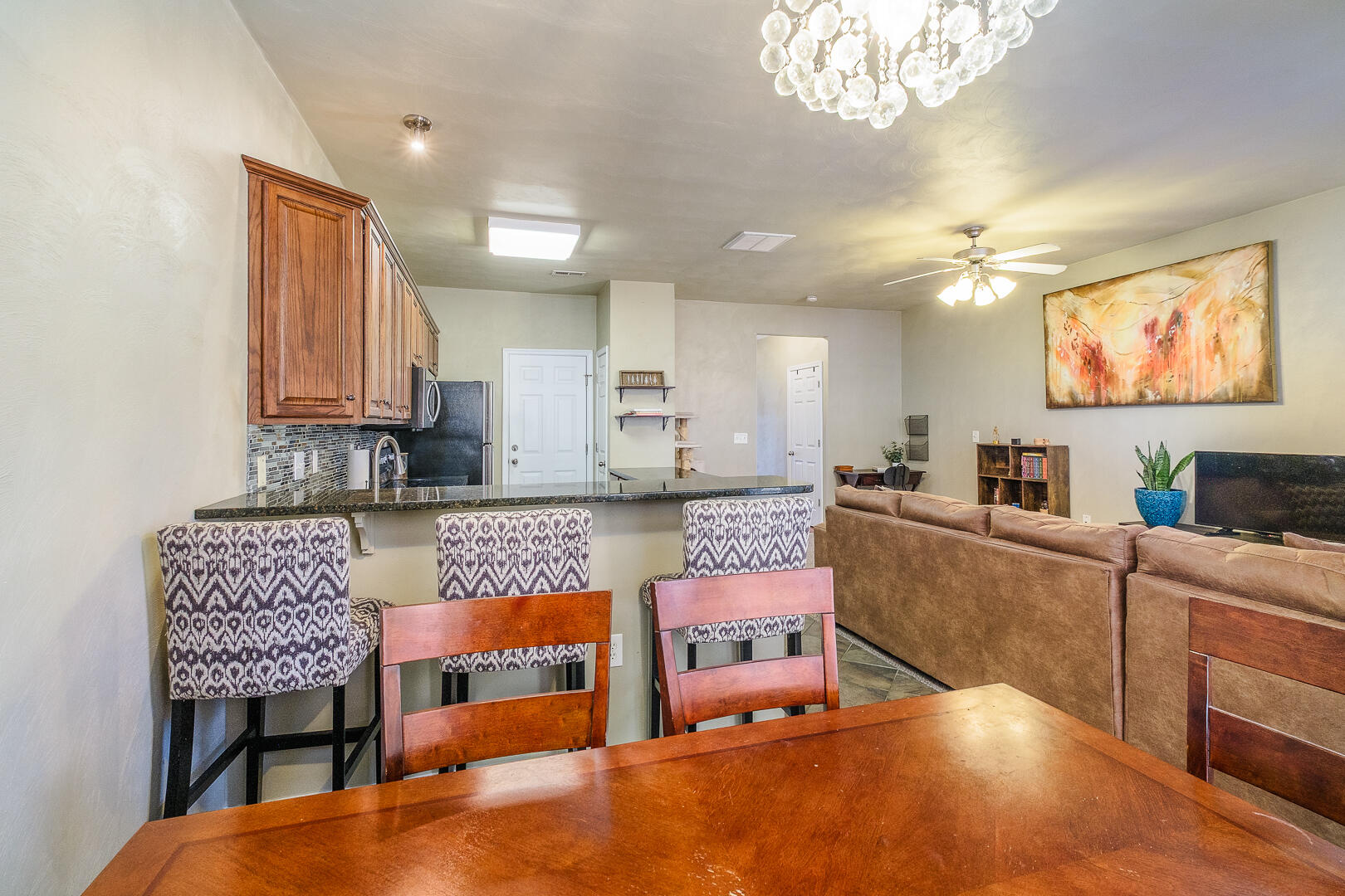 8717 Little Hoop Road Roanoke, VA 24019 - Photo 10 of 31 a living room with furniture and a chandelier