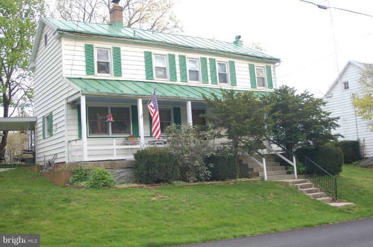 16541 Trenton Road Upperco, MD 21155 - Photo 1 of 18 a front view of a house with a yard