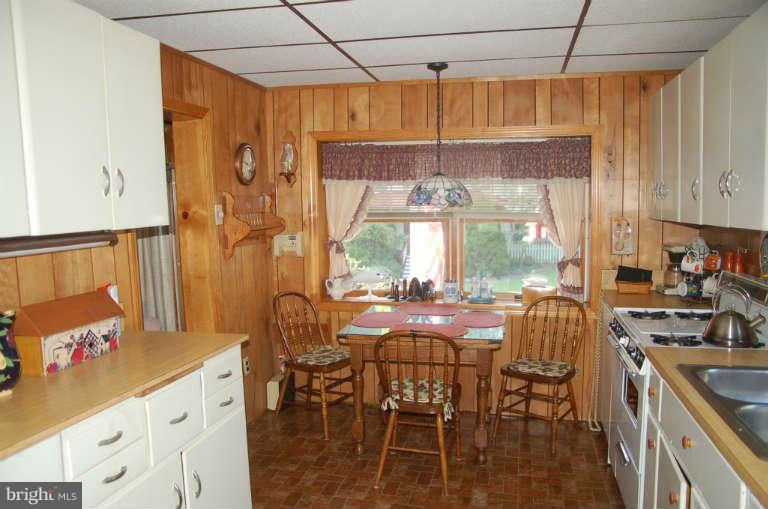 16541 Trenton Road Upperco, MD 21155 - Photo 2 of 18 a view of a dining room with furniture window and outside view