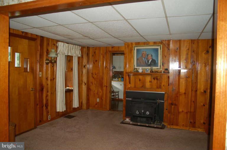 16541 Trenton Road Upperco, MD 21155 - Photo 5 of 18 a room with water heater and a wooden door