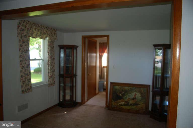 16541 Trenton Road Upperco, MD 21155 - Photo 7 of 18 a room with a door and a window