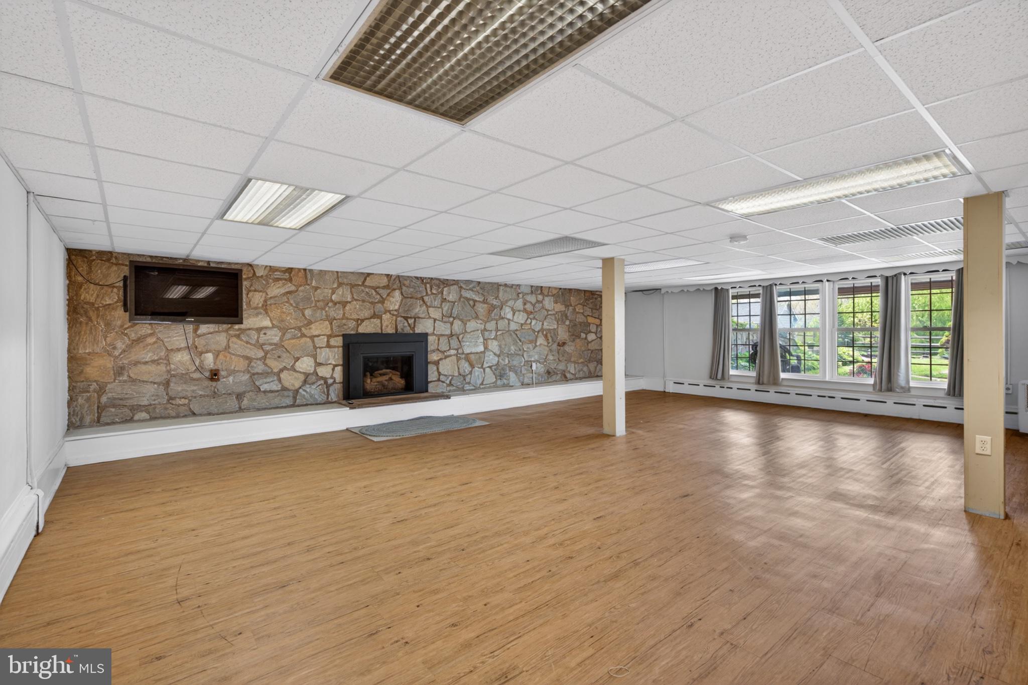 300 Sanatoga Road Pottstown, PA 19465 - Photo 49 of 79 Spacious room with stone fireplace charm.