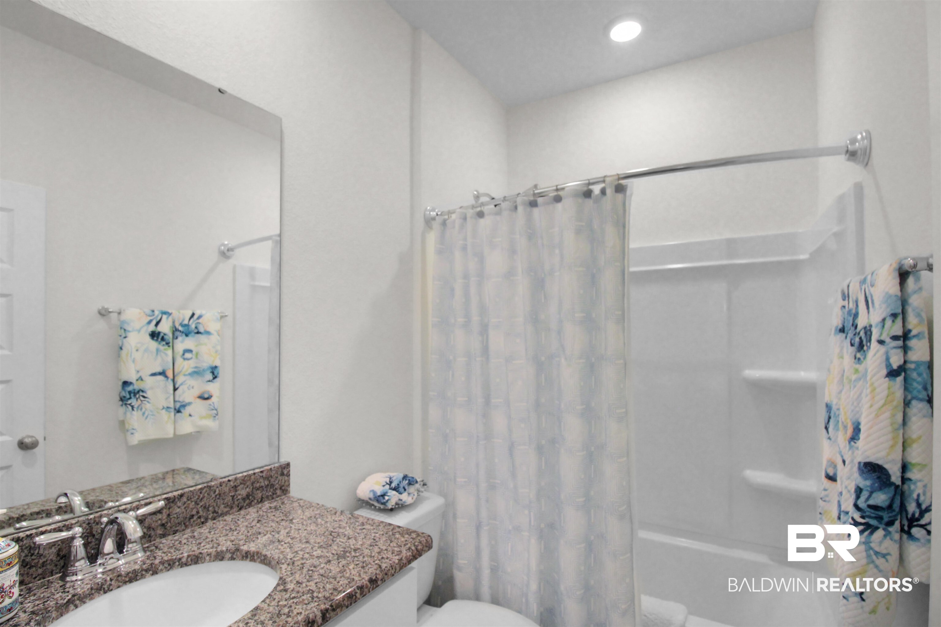 1885 Carly Street Foley, AL 36535 - Photo 23 of 40 Bathroom featuring a white vanity with a granite countertop, undermount sink, and chrome faucet