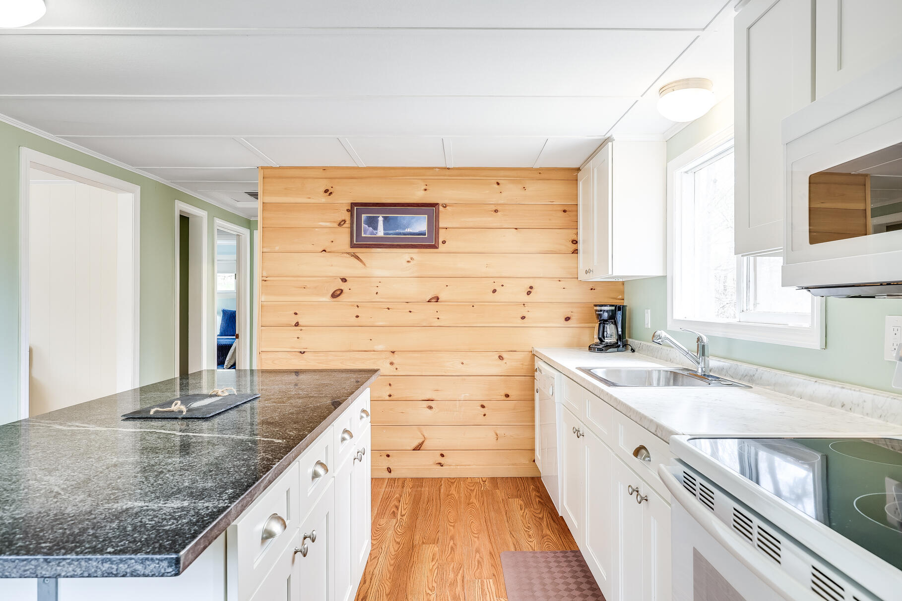 85 Boreen Road Eastham, MA 02642 - Photo 15 of 73 a kitchen with granite countertop a sink stove and cabinets