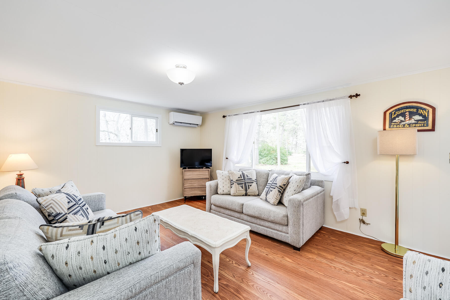 85 Boreen Road Eastham, MA 02642 - Photo 19 of 73 a living room with furniture and a wooden floor
