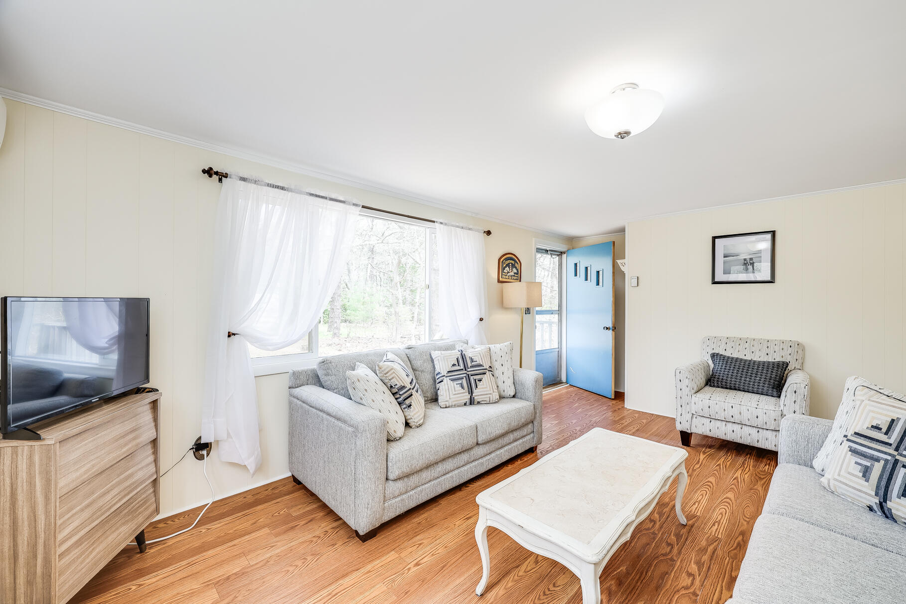 85 Boreen Road Eastham, MA 02642 - Photo 20 of 73 a living room with furniture and a flat screen tv
