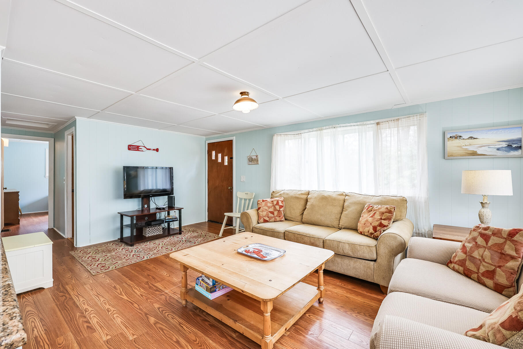 85 Boreen Road Eastham, MA 02642 - Photo 32 of 73 a living room with furniture and a flat screen tv