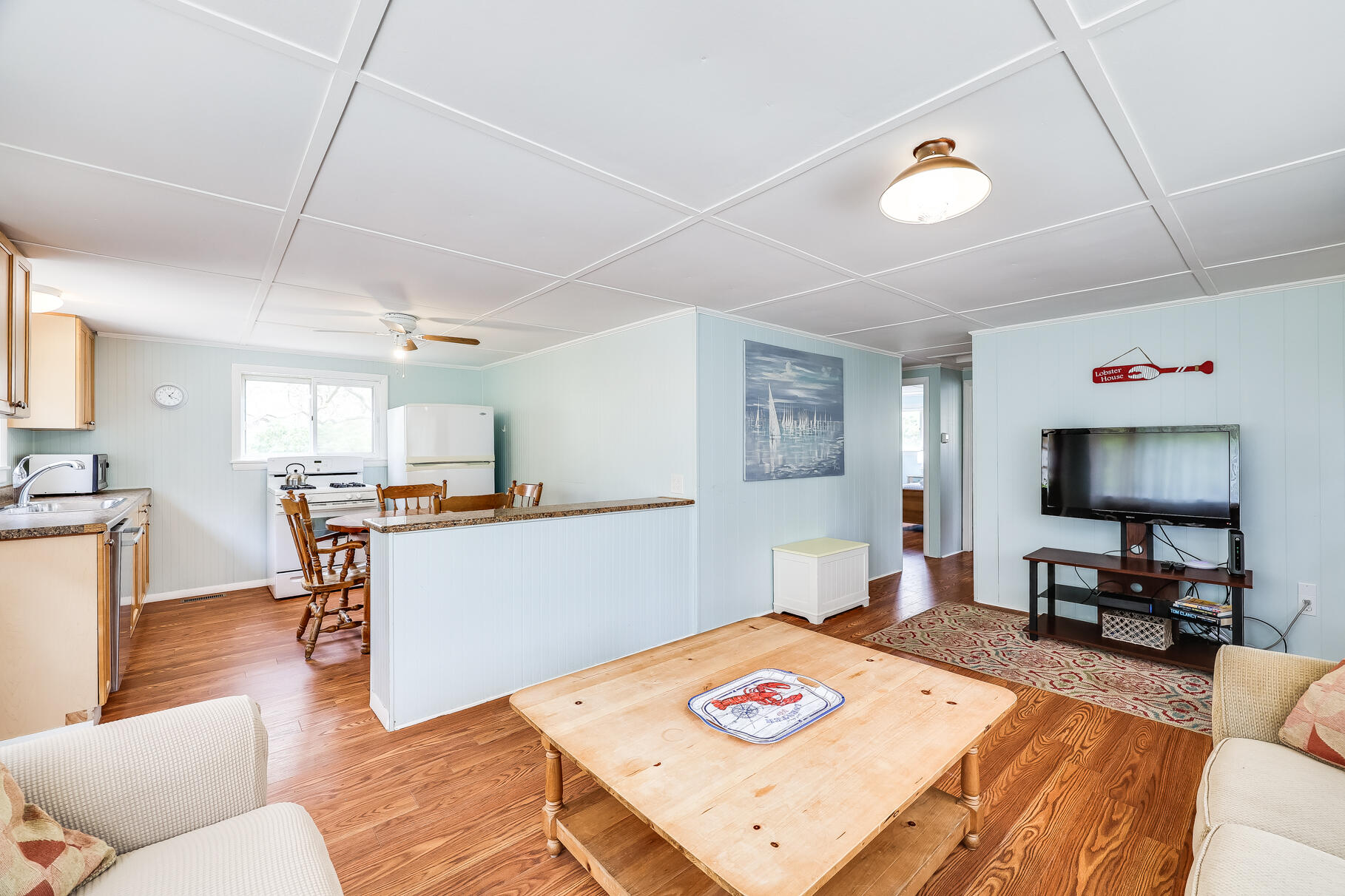 85 Boreen Road Eastham, MA 02642 - Photo 35 of 73 a living room with furniture and a flat screen tv